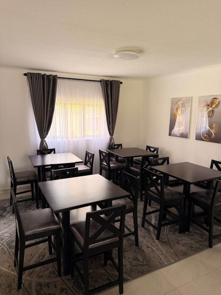 Dining room with dark wood tables and chairs